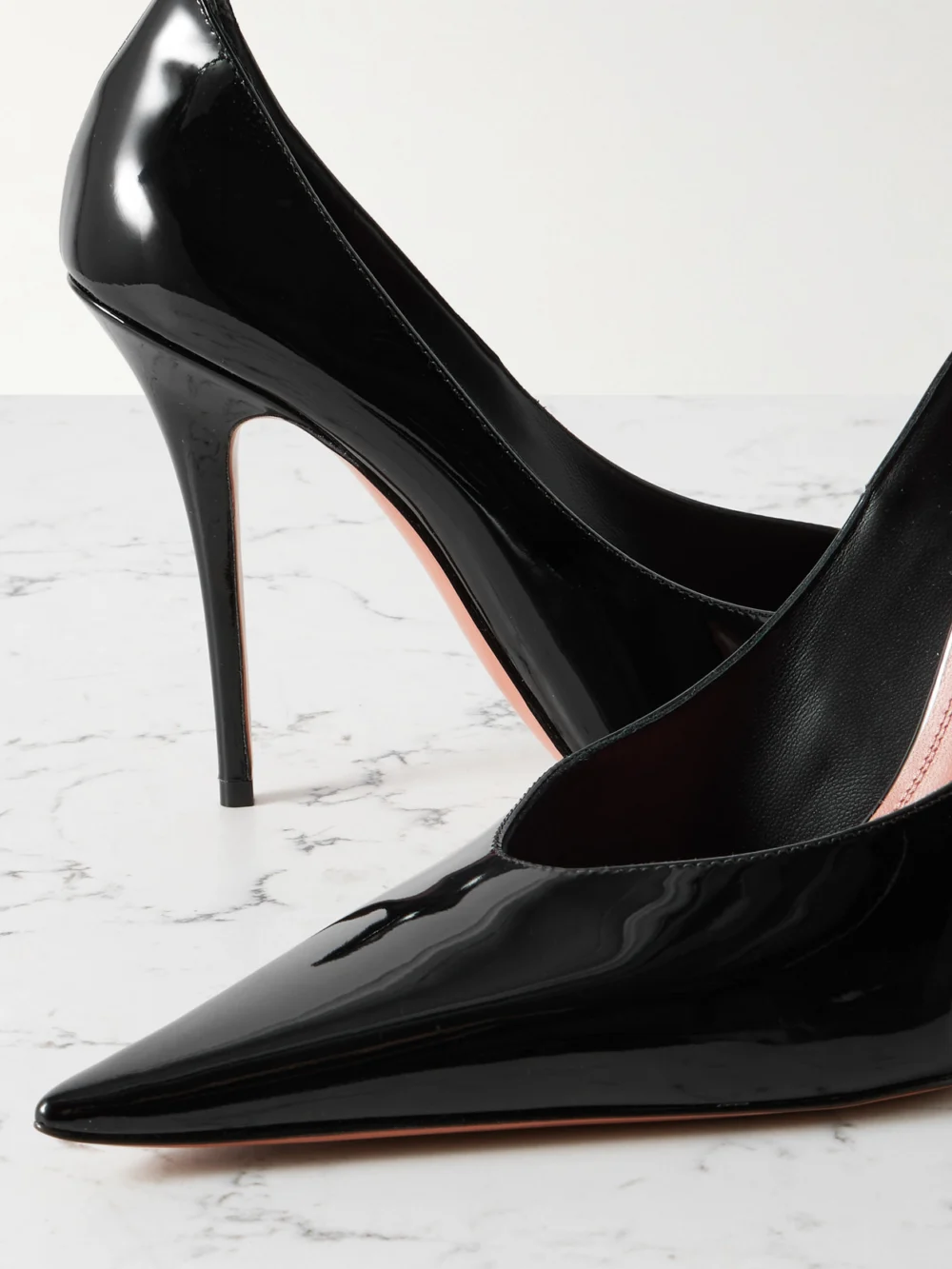 Close-up detail of the Amina Muaddi Anok 105 Patent-leather Point-toe Pumps