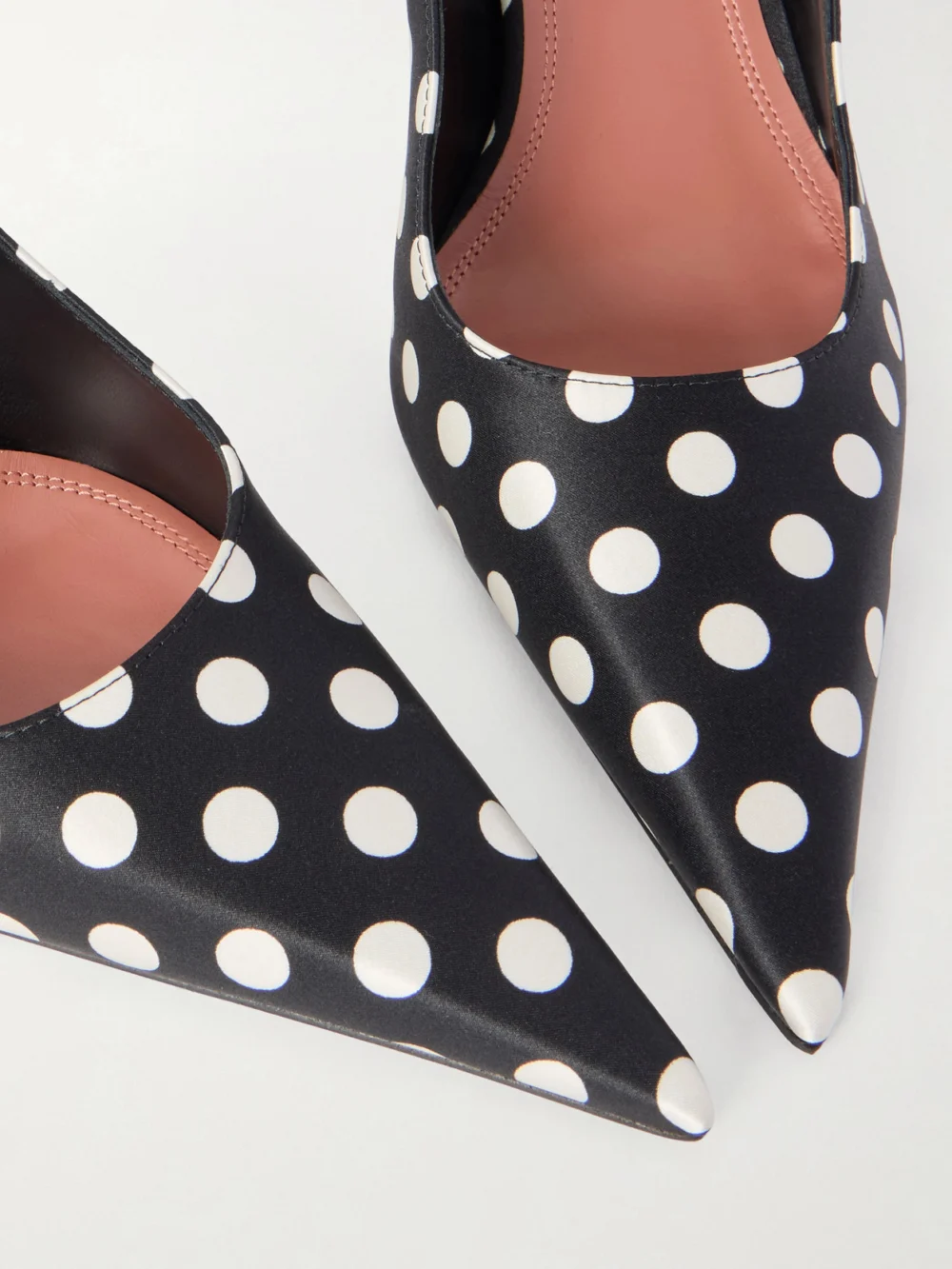 Close-up detail of the Amina Muaddi Barbara Polka-dot Satin Pumps