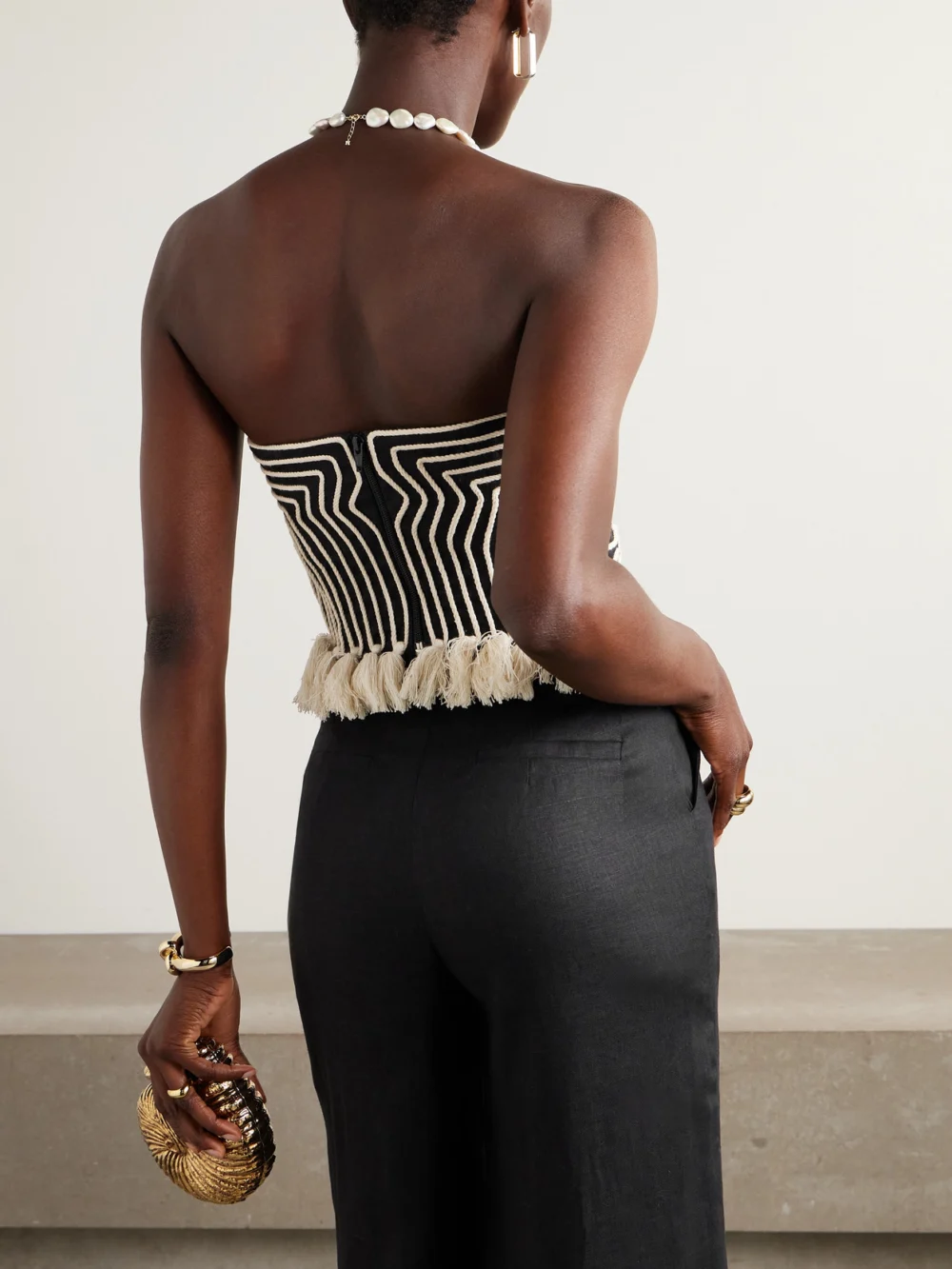 Back view of the Andres Otalora Escuchas Cropped Strapless Tasseled Embroidered Linen Top