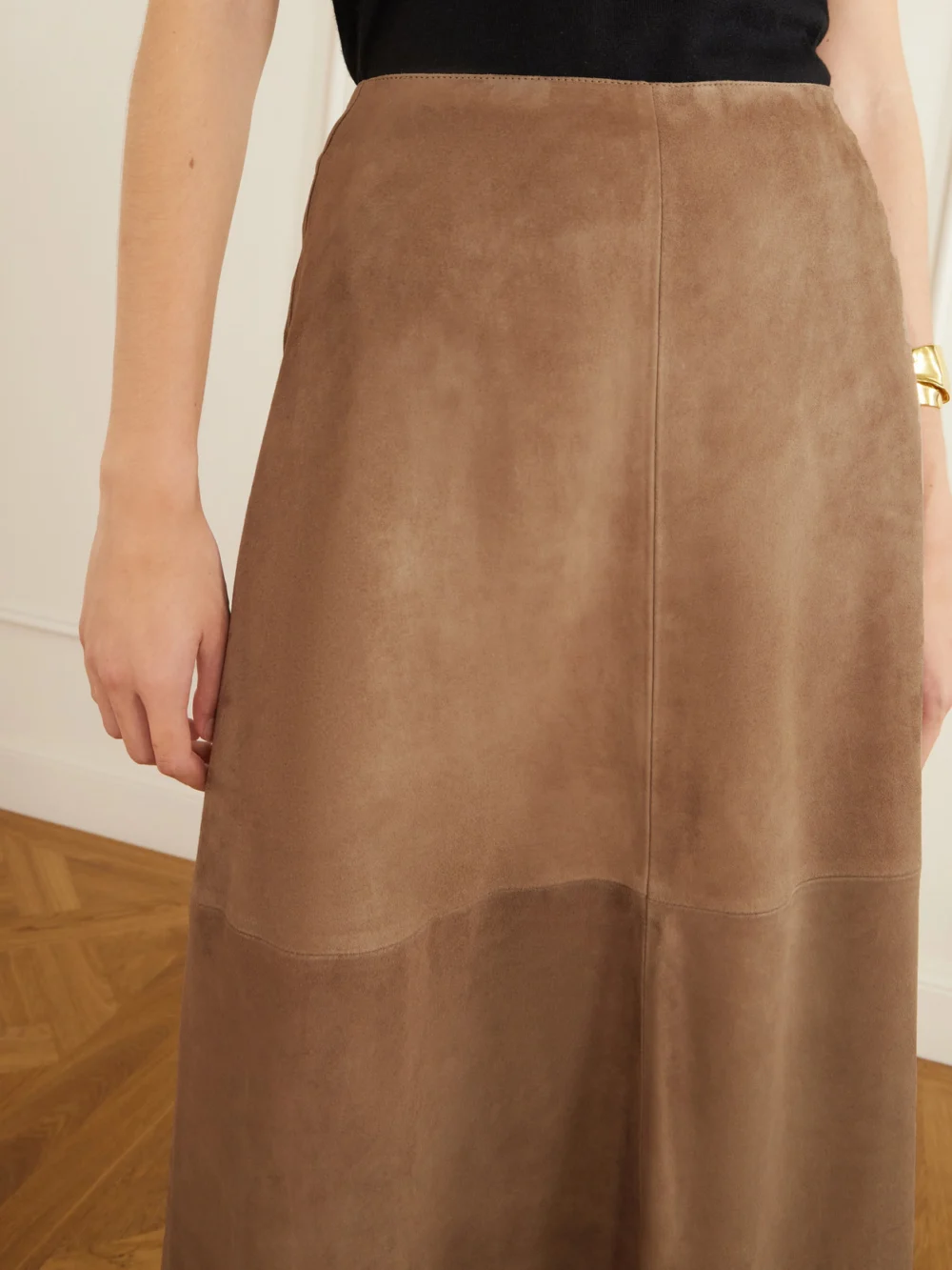 Close-up detail of the Arma Melita Suede Midi Skirt