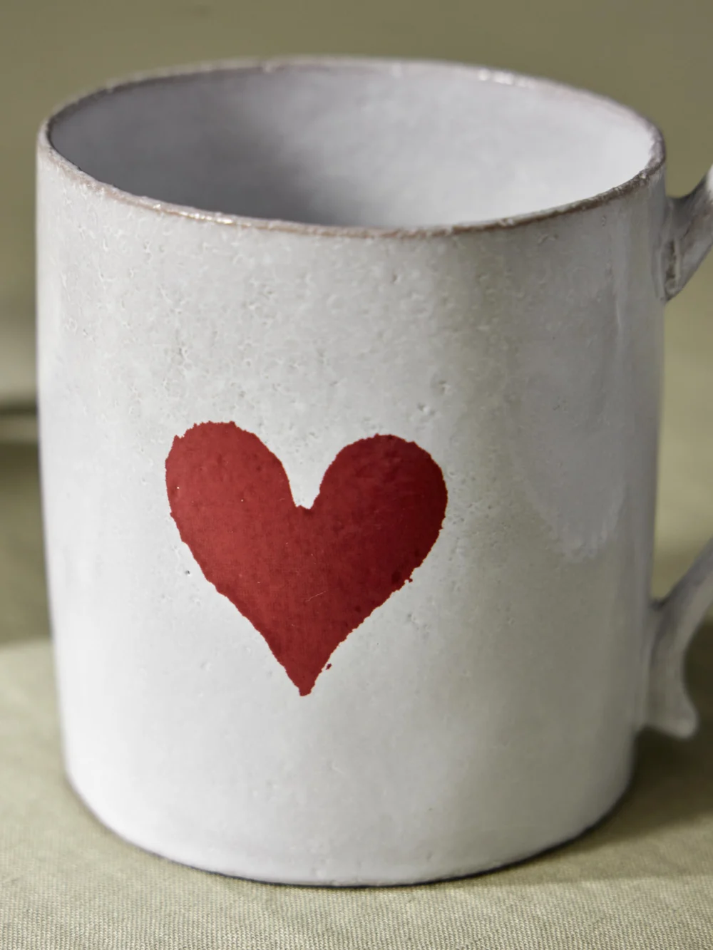 Close-up detail of the Astier De Villatte + John Derian Heart Glazed Ceramic Mug
