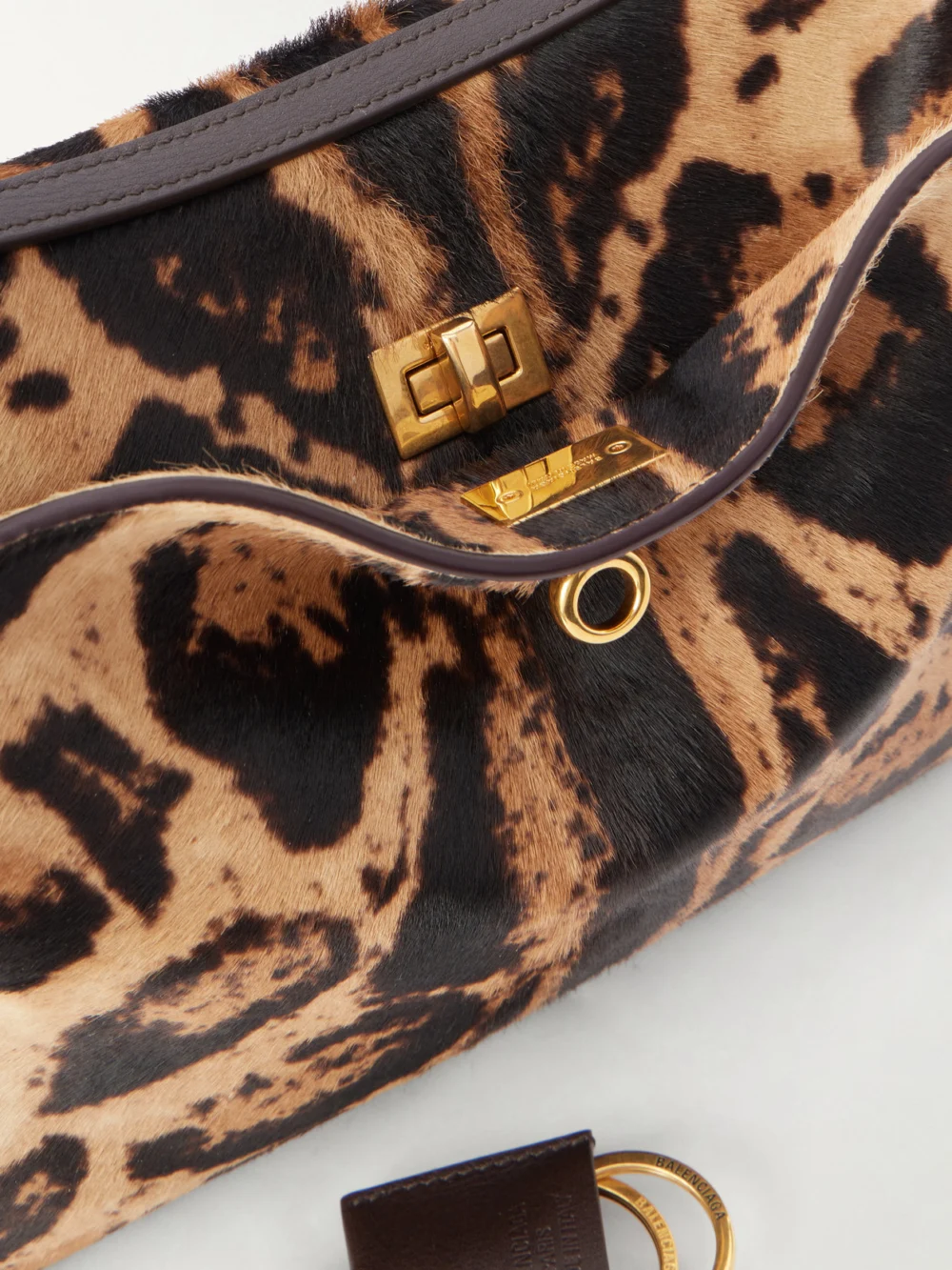 Close-up detail of the Balenciaga Rodeo Leopard-print Leather-trimmed Pony Hair Shoulder Bag