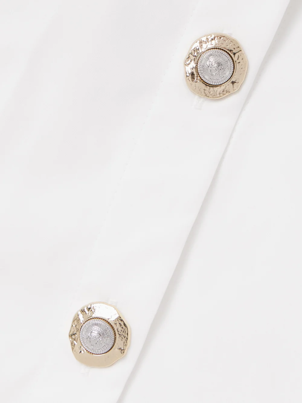 Close-up detail of the Balmain Pleated Cotton-poplin Halterneck Mini Dress