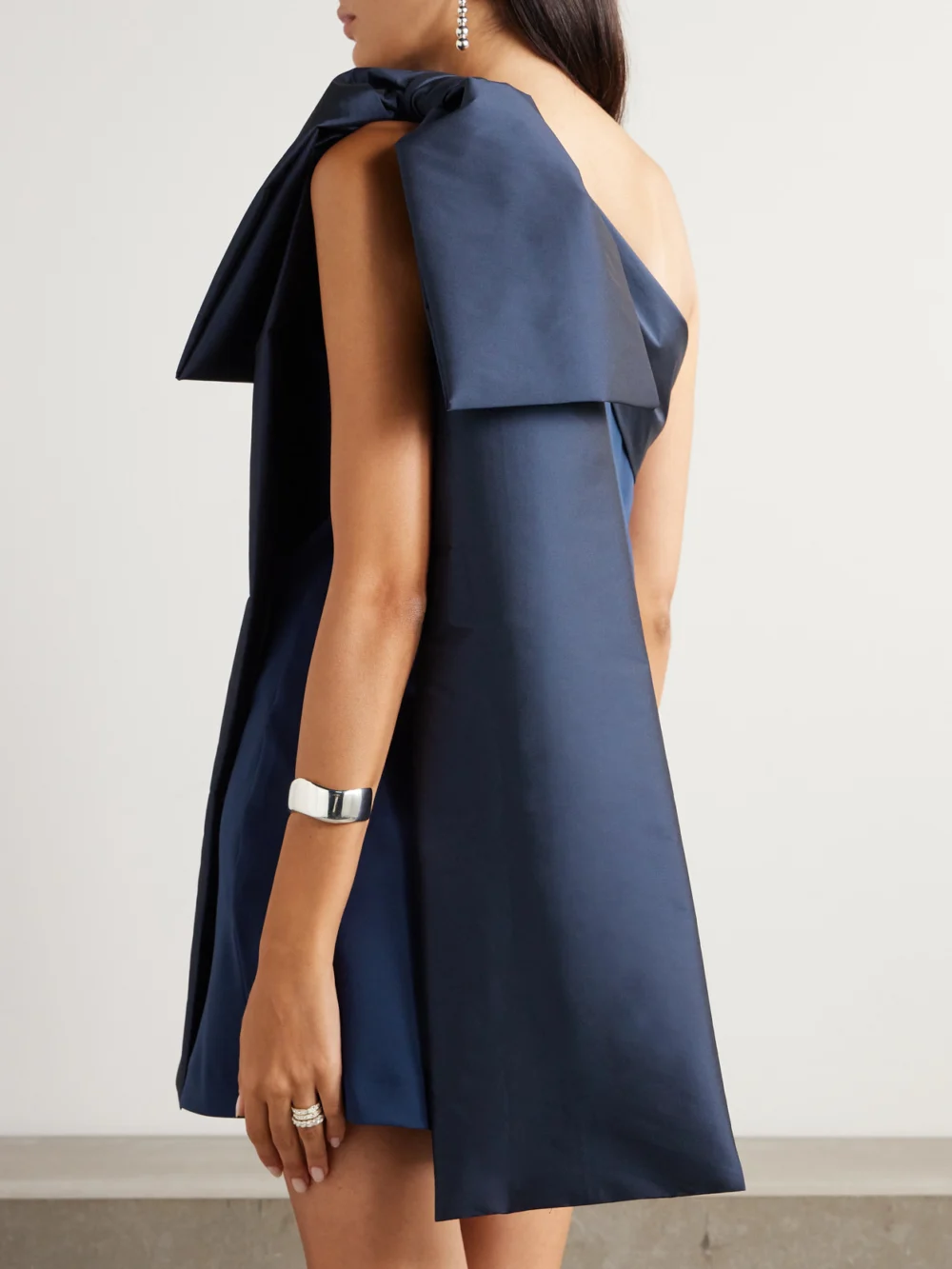 Back view of the Bernadette Adrian Bow-embellished One-shoulder Taffeta-trimmed Crepe Mini Dress