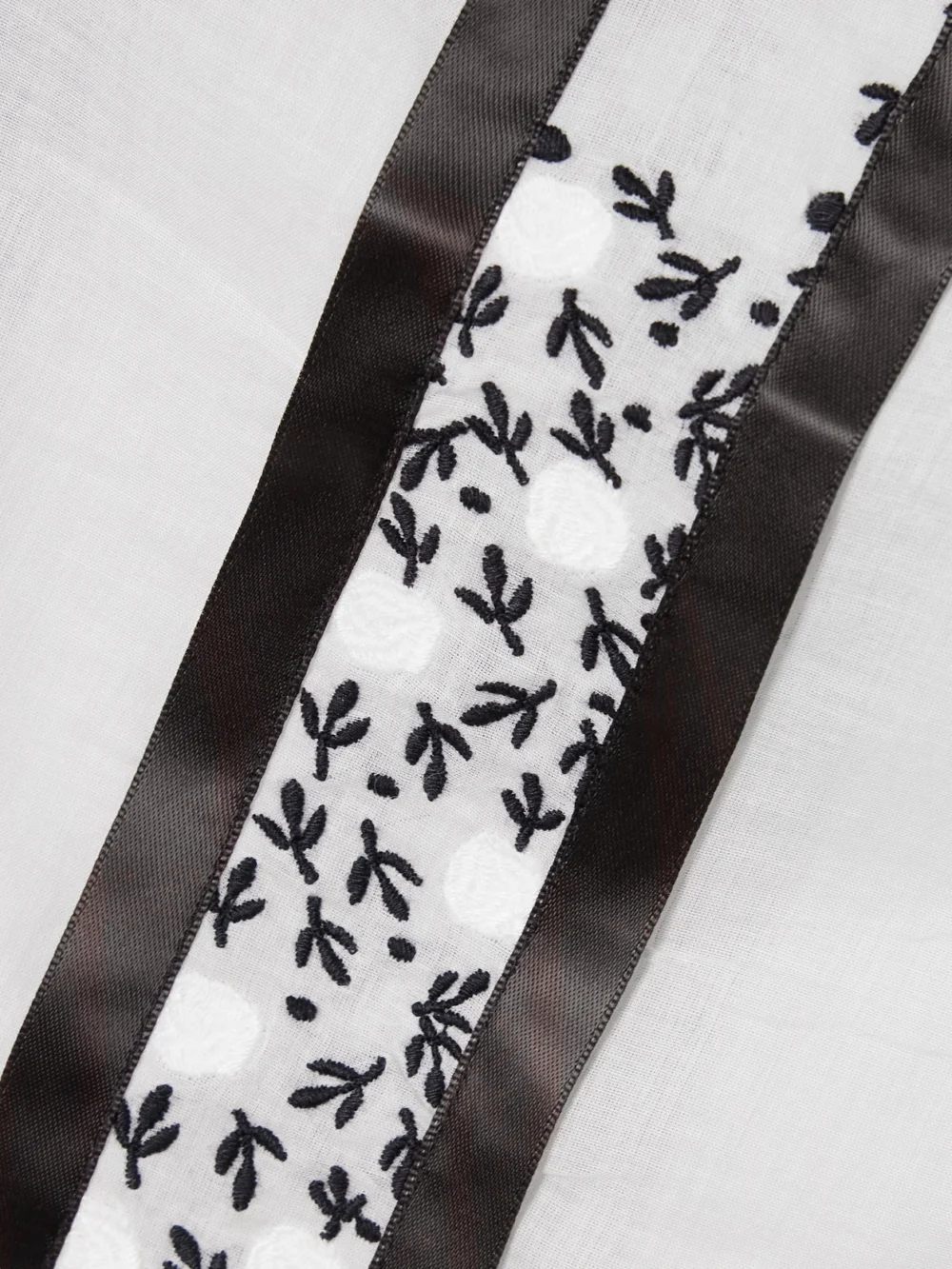Close-up detail of the Bode Lattice Sprig Embroidered Button-embellished Satin-trimmed Cotton Blouse