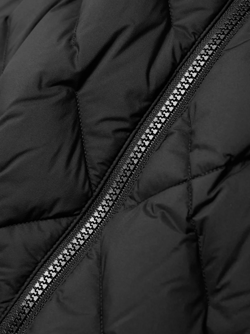 Close-up detail of the Burberry Appliquéd Leather-trimmed Padded Quilted Shell Down Jacket