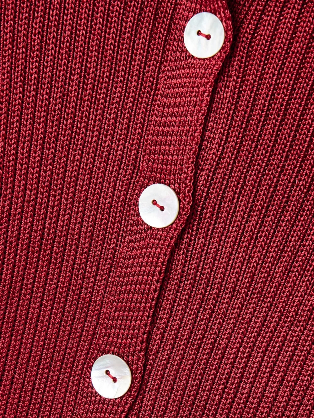 Close-up detail of the Calle Del Mar Cropped Ribbed-knit Cardigan