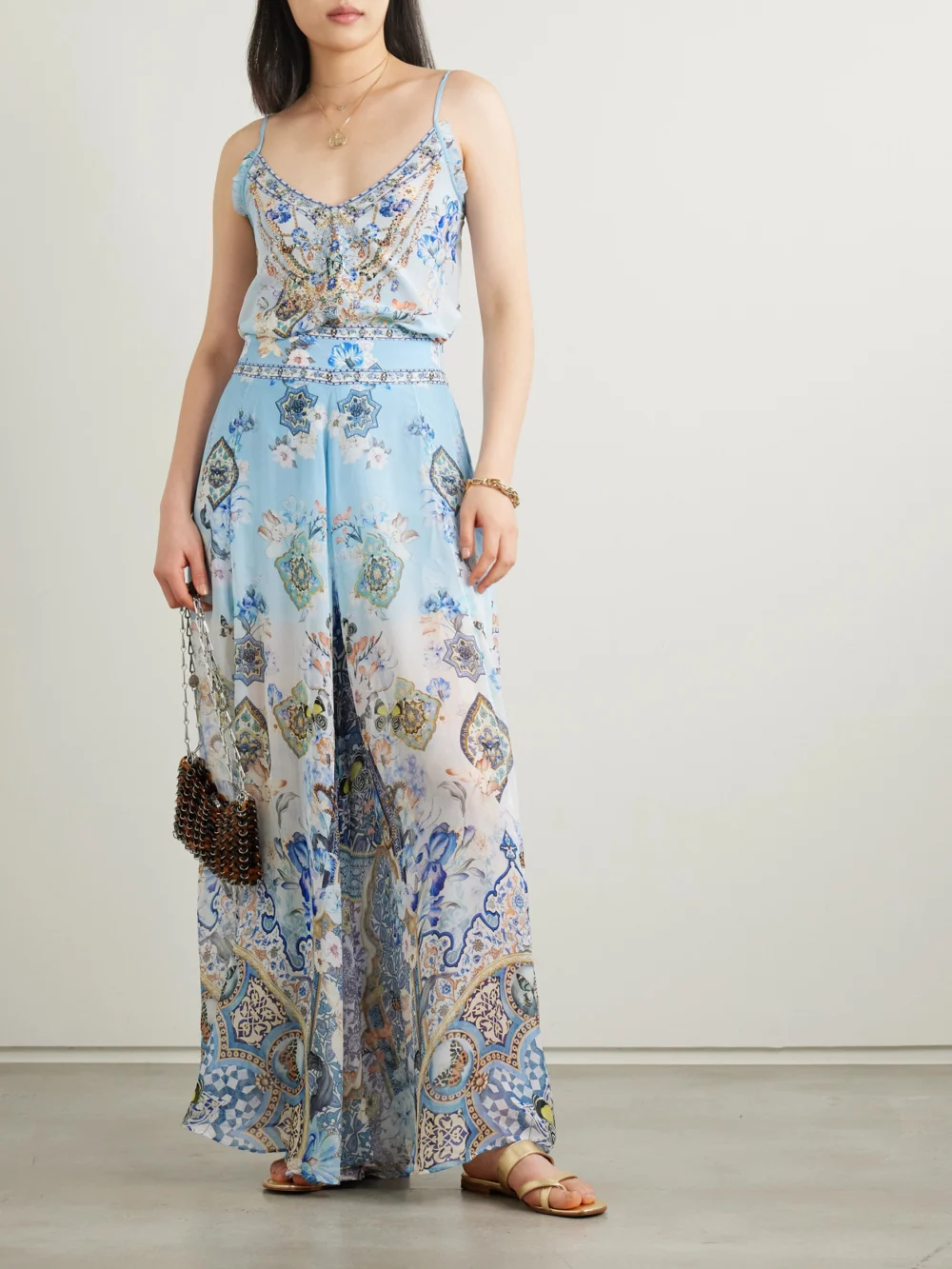 Camilla Al Manial Palace Embellished Printed Silk-crepon Wide Leg Pants, worn by a model