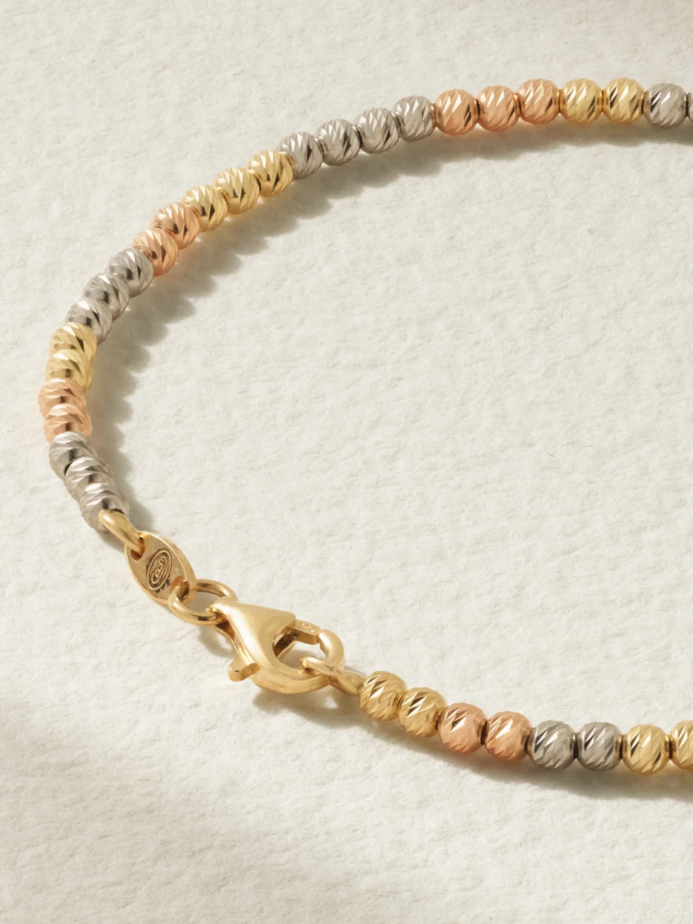 Back view of the Carolina Bucci Discoball 18-karat Rose, White and Yellow Gold Bracelet
