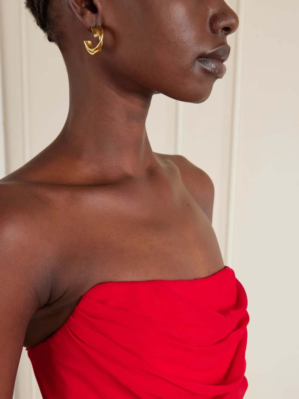 Close-up detail of the Carolina Herrera Strapless Draped Silk-chiffon Midi Dress
