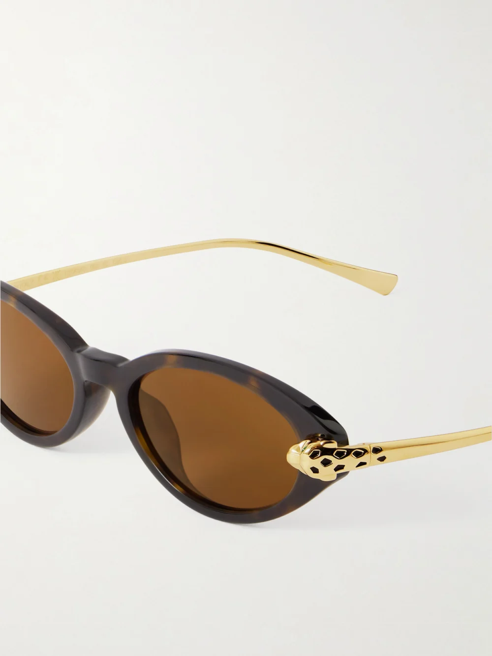 Close-up detail of the Cartier Eyewear Panthère De Cartier Oval-frame Tortoiseshell Acetate and Gold-tone Sunglasses