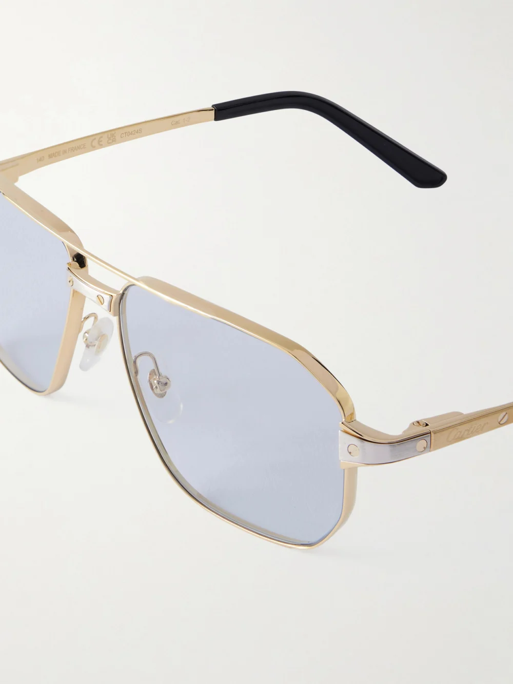 Close-up detail of the Cartier Eyewear Santos De Cartier Gold- and Silver-tone Aviator-style Sunglasses