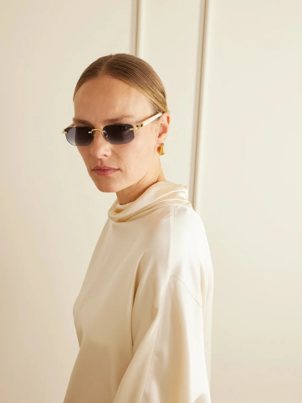 Back view of the Cartier Eyewear Signature C Rimless Rectangular-frame Gold-tone and Acetate Sunglasses