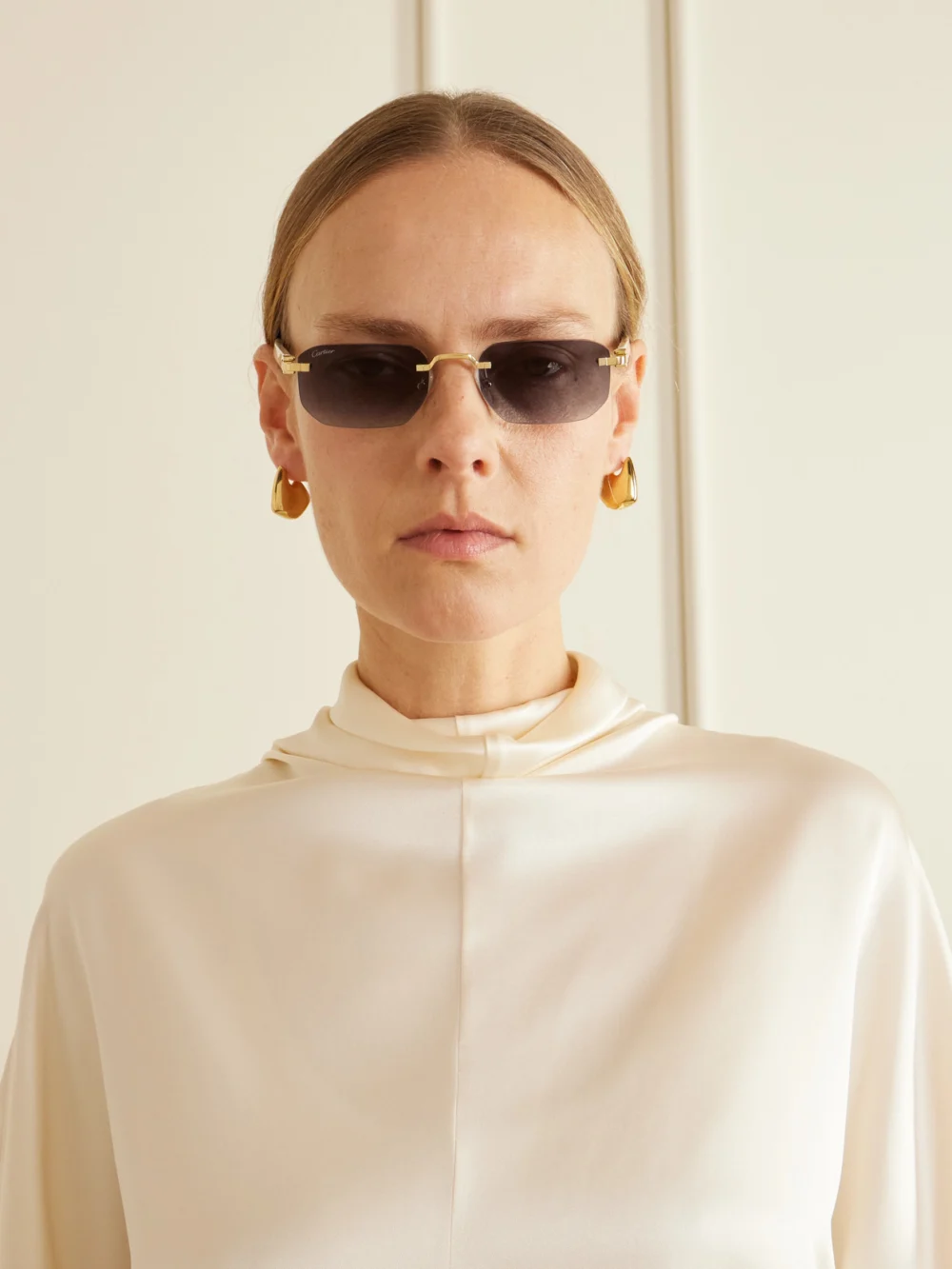 Cartier Eyewear Signature C Rimless Rectangular-frame Gold-tone and Acetate Sunglasses, styled view
