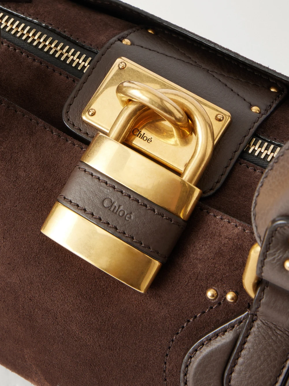 Close-up detail of the Chloé Paddington Leather-trimmed Suede Shoulder Bag