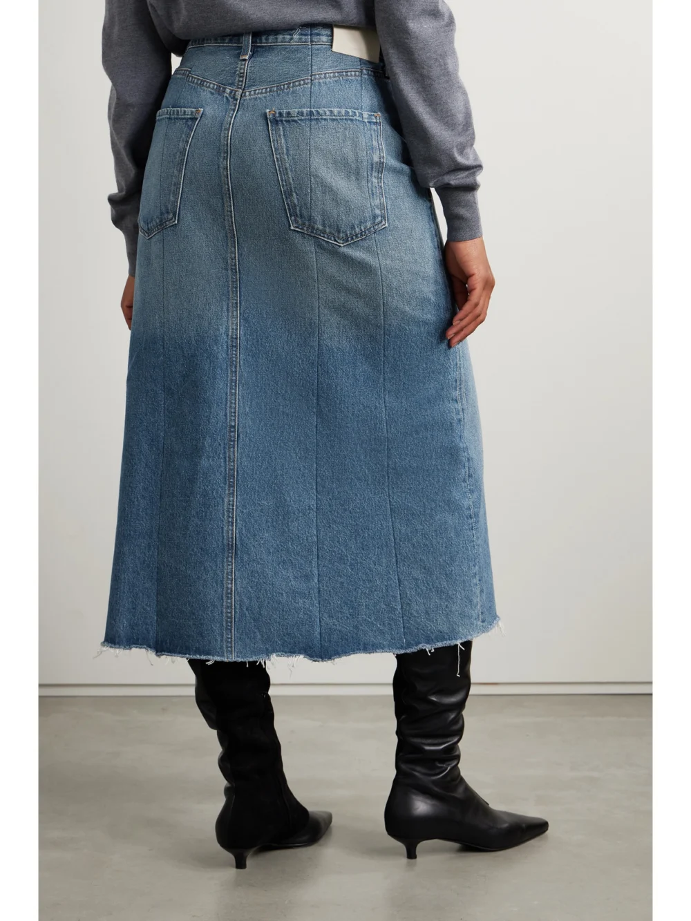 Back view of the Citizens of Humanity Raian Frayed Paneled Organic Denim Midi Skirt