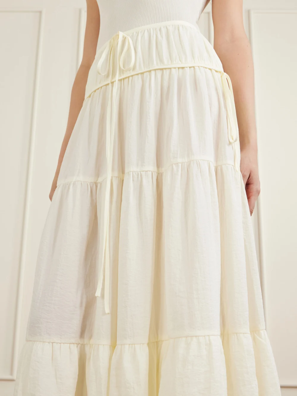 Close-up detail of the Co Gathered Crepe Bubble Maxi Skirt