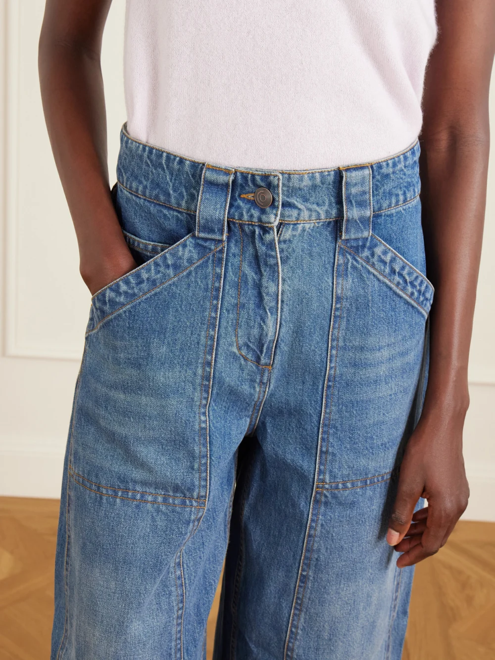Close-up detail of the Co Paneled Mid-rise Barrel-leg Jeans