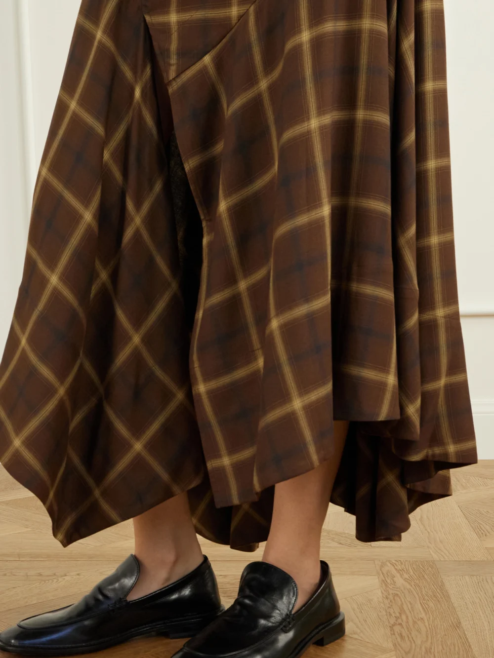 Close-up detail of the Co Slash Checked Crepe Midi Skirt