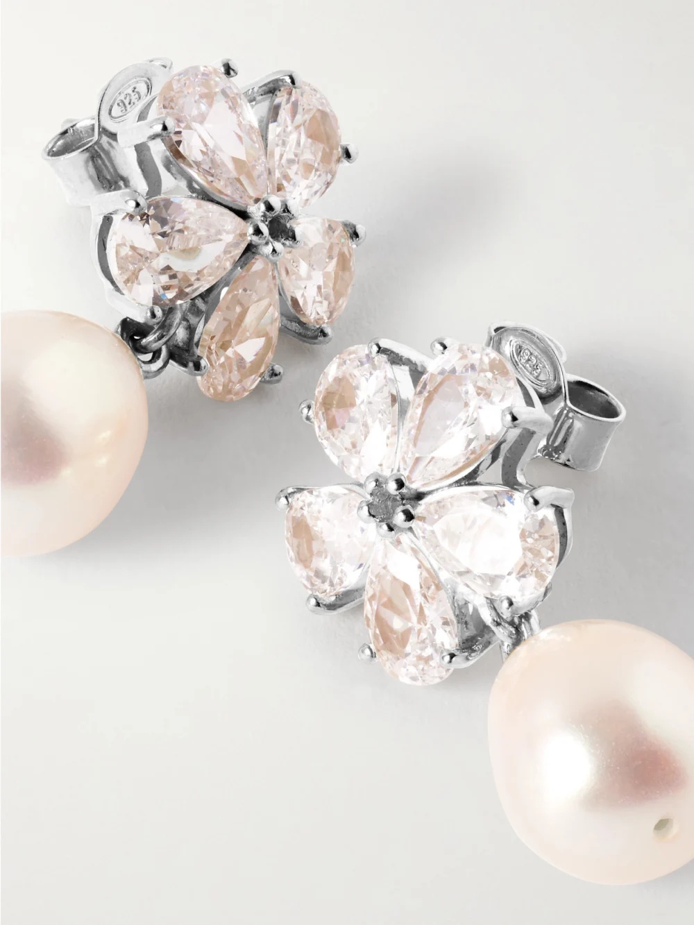 Close-up detail of the Completedworks Gold-plated, Cubic Zirconia Pearl Earrings