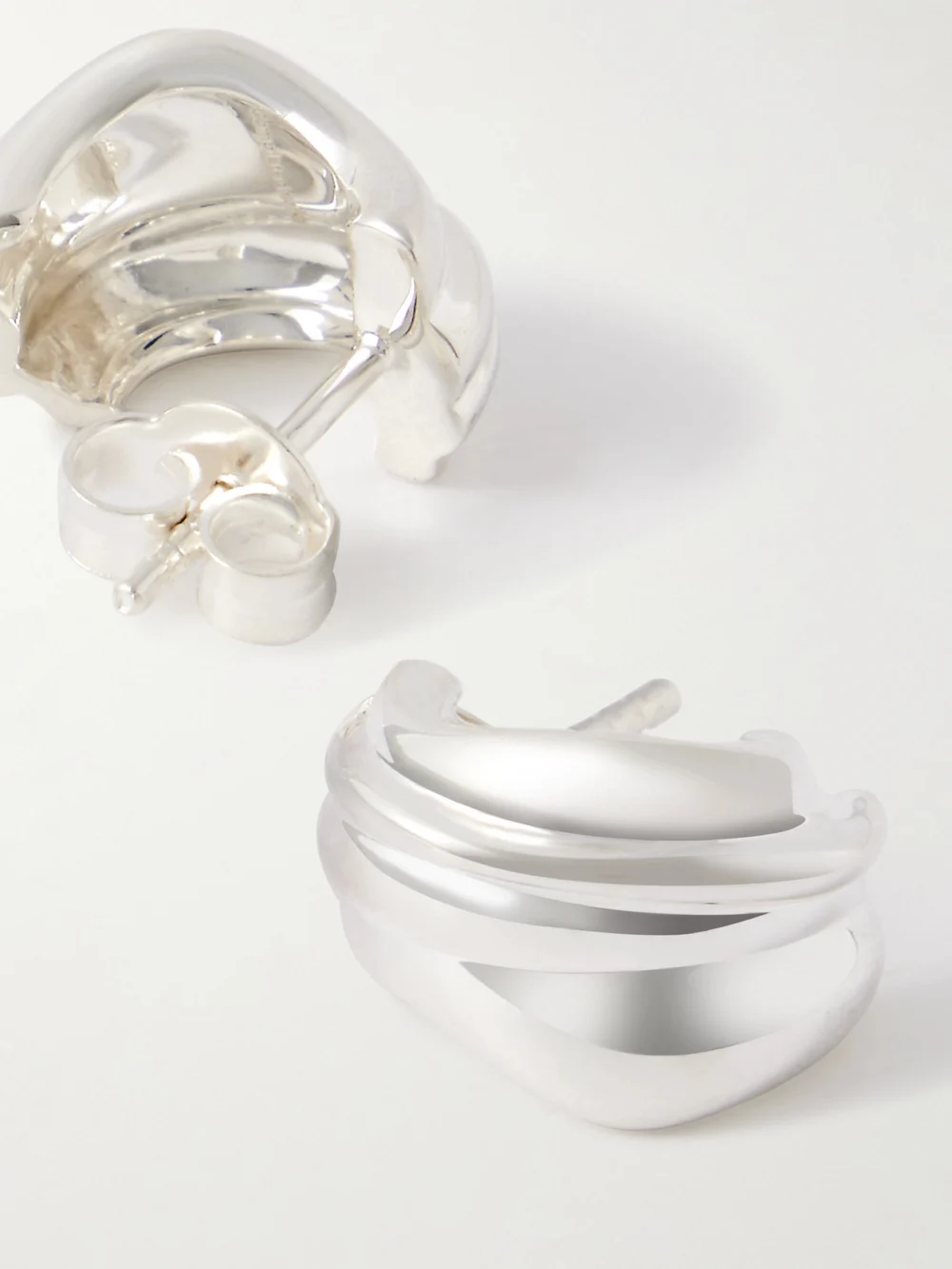 Close-up detail of the Completedworks Recycled Silver Hoop Earrings