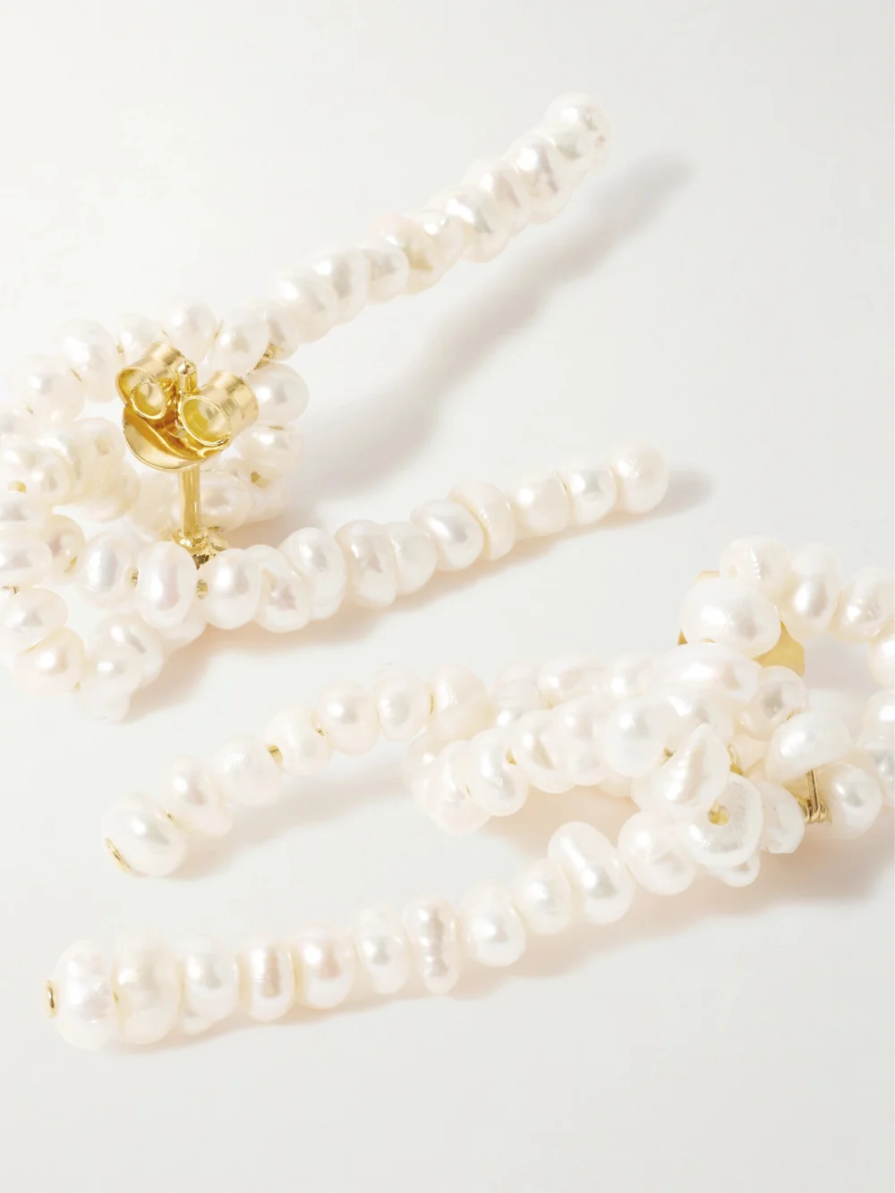 Close-up detail of the Completedworks The Break Between the Clouds Recycled Gold Vermeil Pearl Earrings