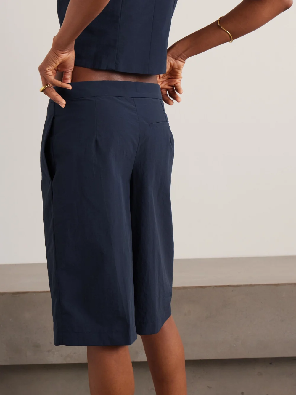 Back view of the Conner Ives Pleated Woven Shorts