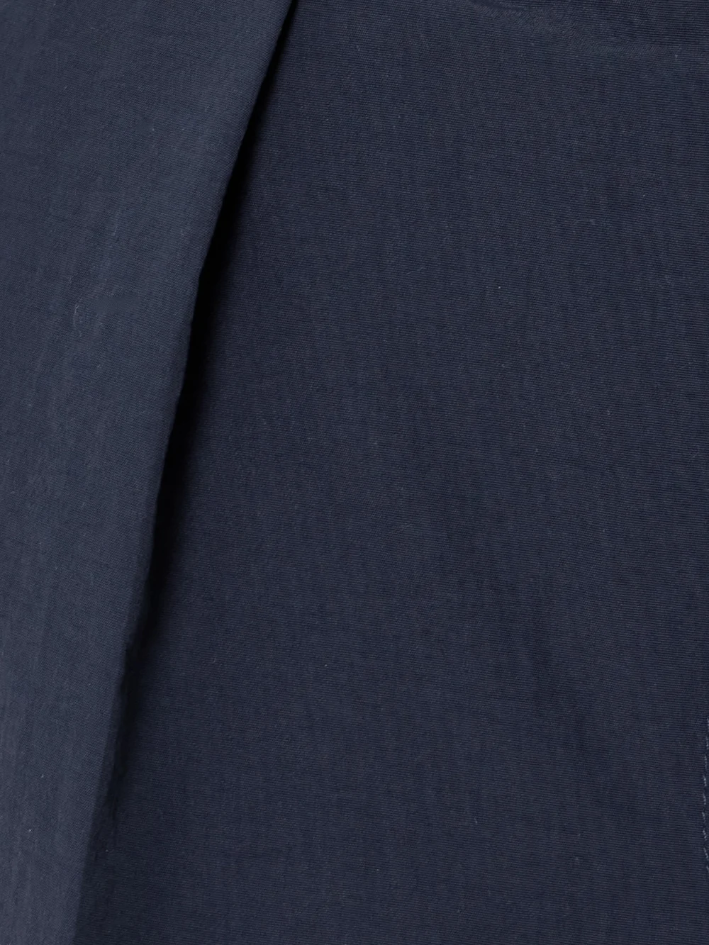 Close-up detail of the Conner Ives Pleated Woven Shorts