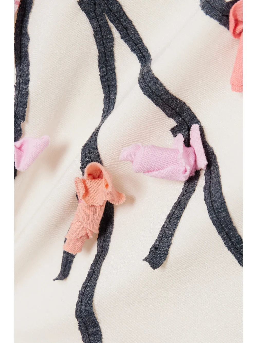 Close-up detail of the Conner Ives Tie-neck Appliquéd Stretch-micro Modal Jersey Tank