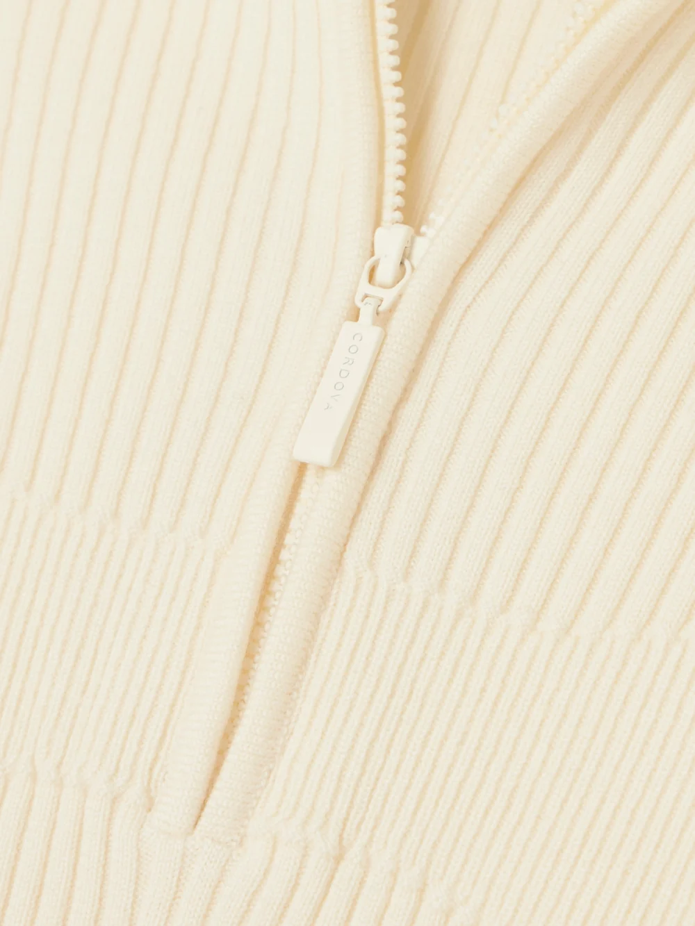Close-up detail of the Cordova Butte Ribbed Merino-wool Turtleneck Bodysuit