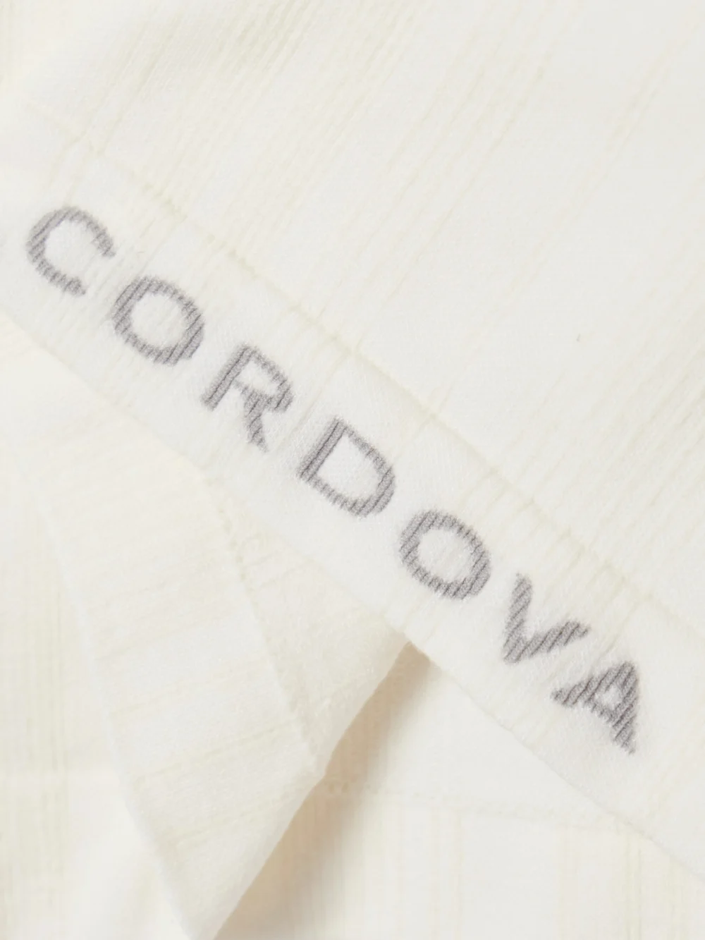 Close-up detail of the Cordova Sol Ribbed Stretch-jersey Turtleneck Top