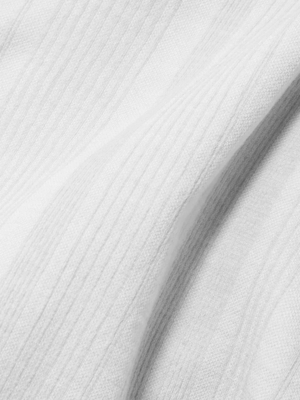 Close-up detail of the Cordova Sol Ribbed Stretch-jersey Turtleneck Top