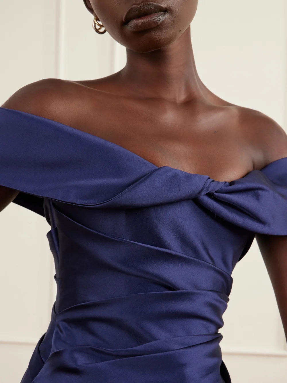 Close-up detail of the Costarellos Devina Off-the-shoulder Draped Duchess-satin Blouse