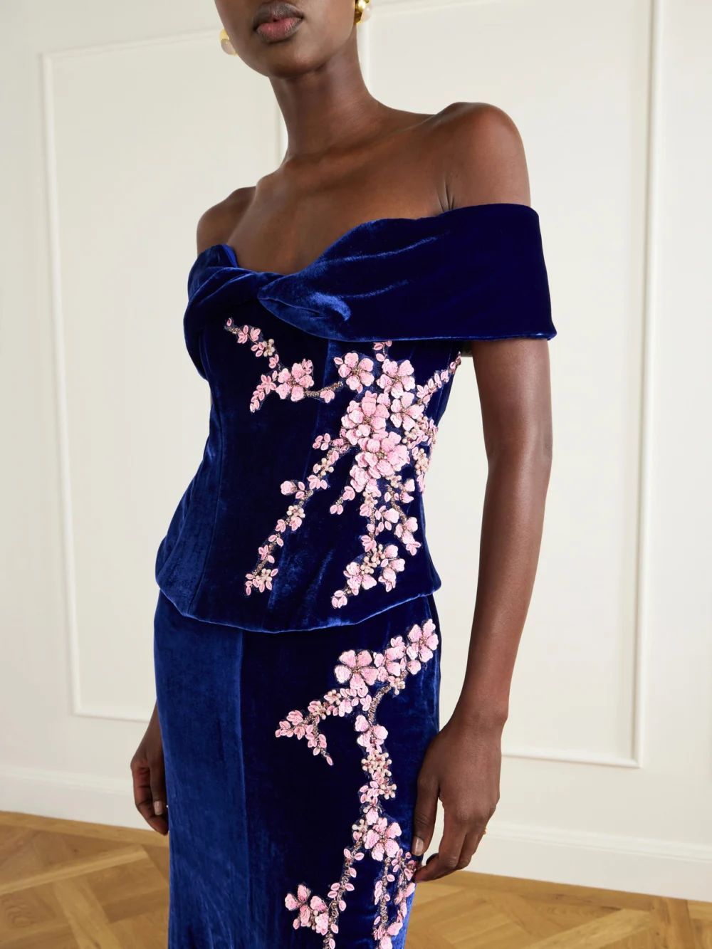 Close-up detail of the Costarellos Rielle Flower-appliqué Off-shoulder Velvet Gown