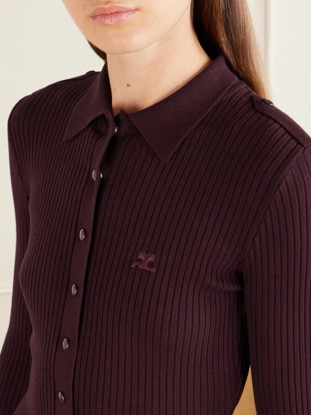 Close-up detail of the Courrèges Logo-embroidered Ribbed Polo Midi Dress