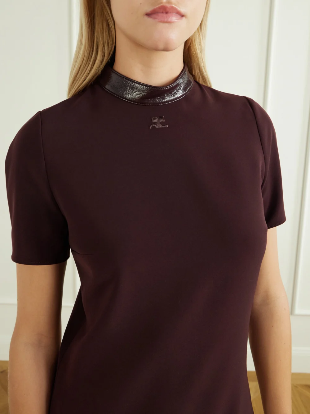 Close-up detail of the Courrèges Vinyl-trimmed Logo-embroidered Crepe Mini Dress