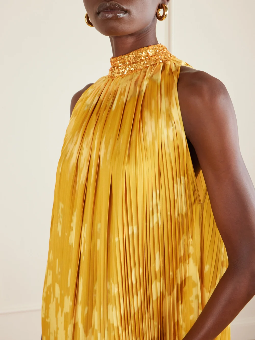 Close-up detail of the Dima Ayad Embellished Tie-dyed Plissé-satin Gown
