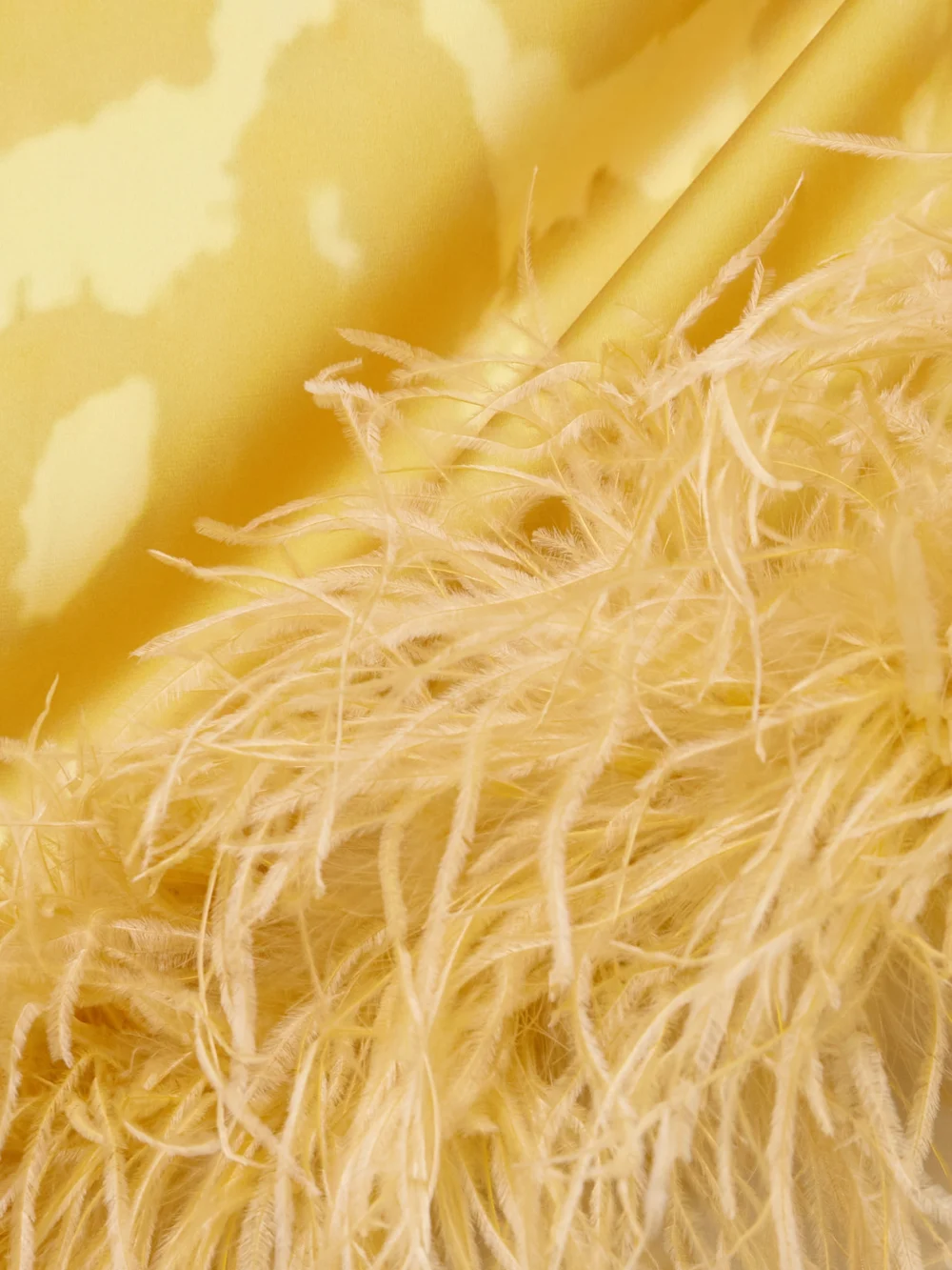 Close-up detail of the Dima Ayad Feather-trimmed Tie-dyed Satin Top