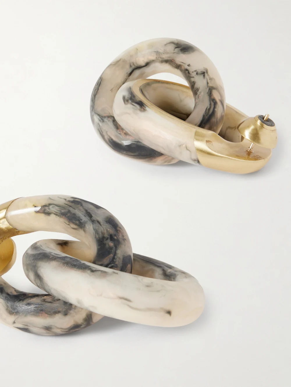 Close-up detail of the Dinosaur Designs Rock Large Gold-tone Resin Earrings