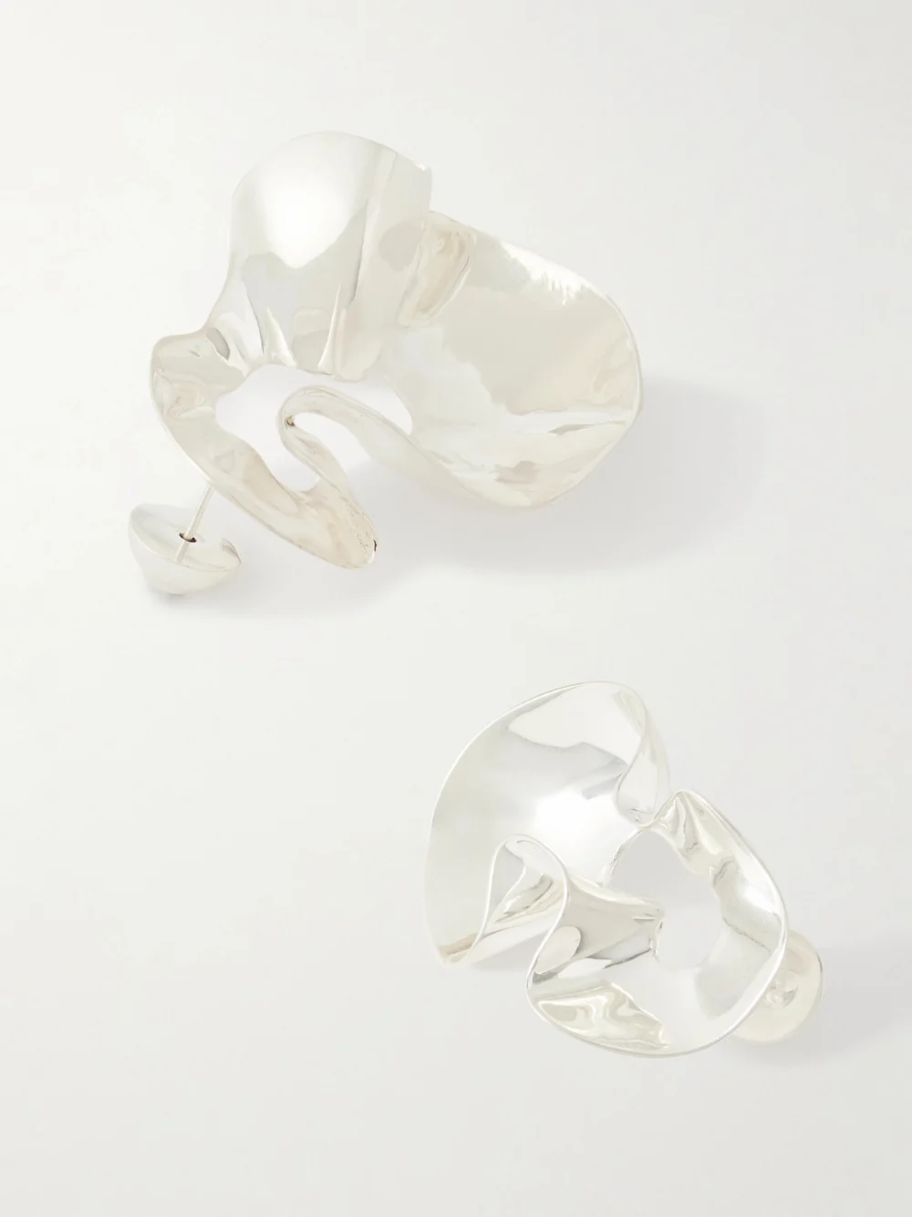 Close-up detail of the Dinosaur Designs Wave Silver-plated Earrings