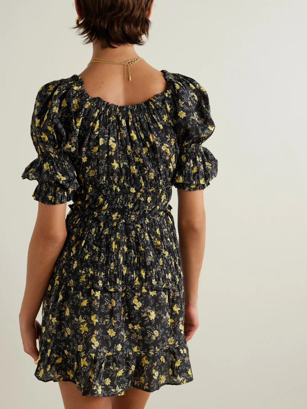 Back view of the Dôen Ismene Shirred Floral-print Organic Cotton-blend Voile Mini Dress