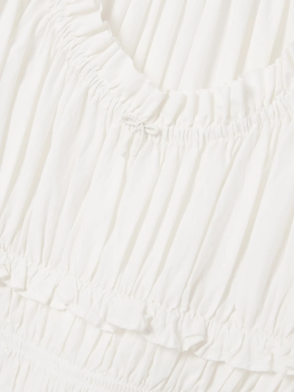 Close-up detail of the Dôen Leanne Shirred Organic Cotton-poplin Midi Dress