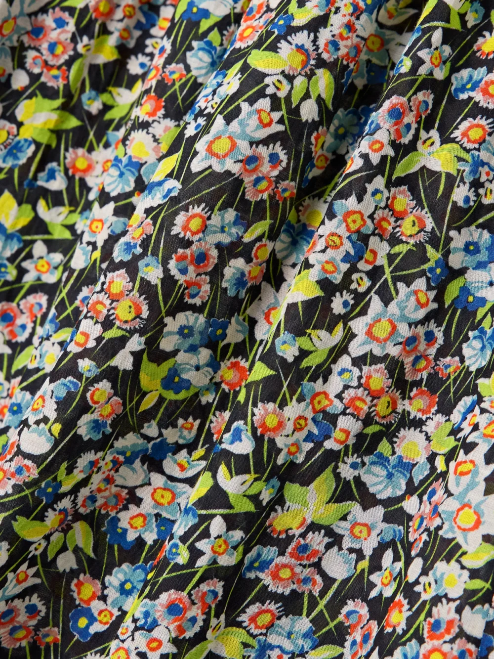 Close-up detail of the Dôen Rosenda Ruffled Shirred Floral-print Organic Cotton-blend Voile Midi Dress