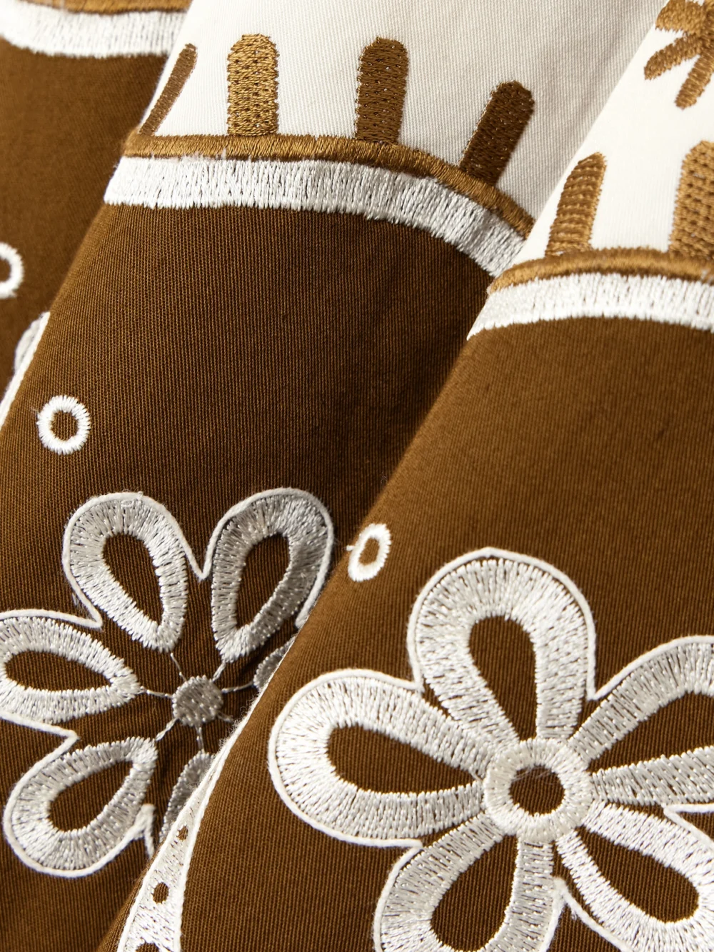 Close-up detail of the Emporio Sirenuse Amelianna Embroidered Cotton-blend Drill Maxi Skirt