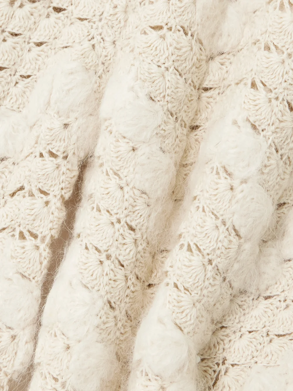 Close-up detail of the Escvdo Brisa Scalloped Crocheted Alpaca Wide-leg Pants