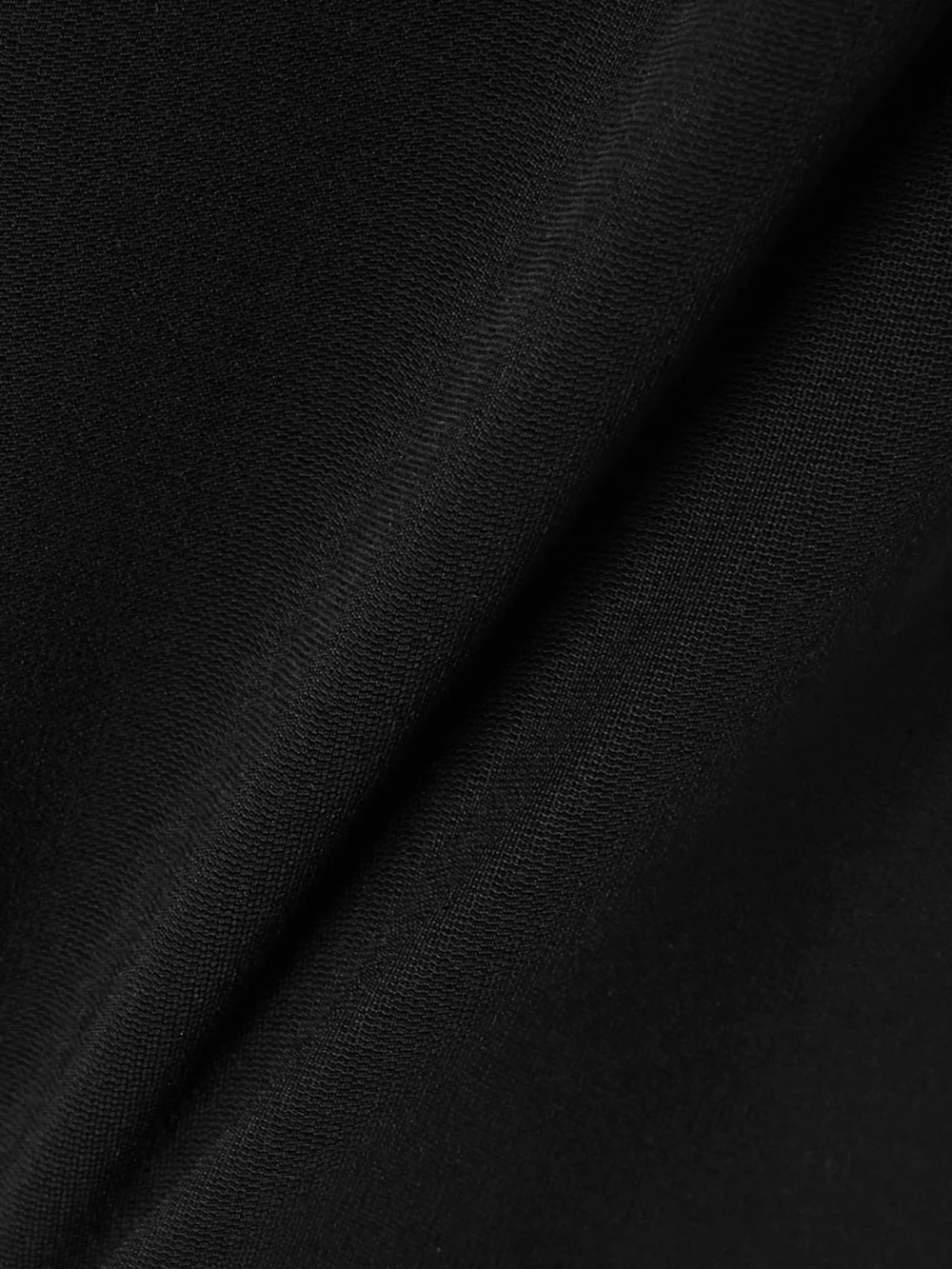 Close-up detail of the Esse Studios Off-the-shoulder Stretch-knit Top