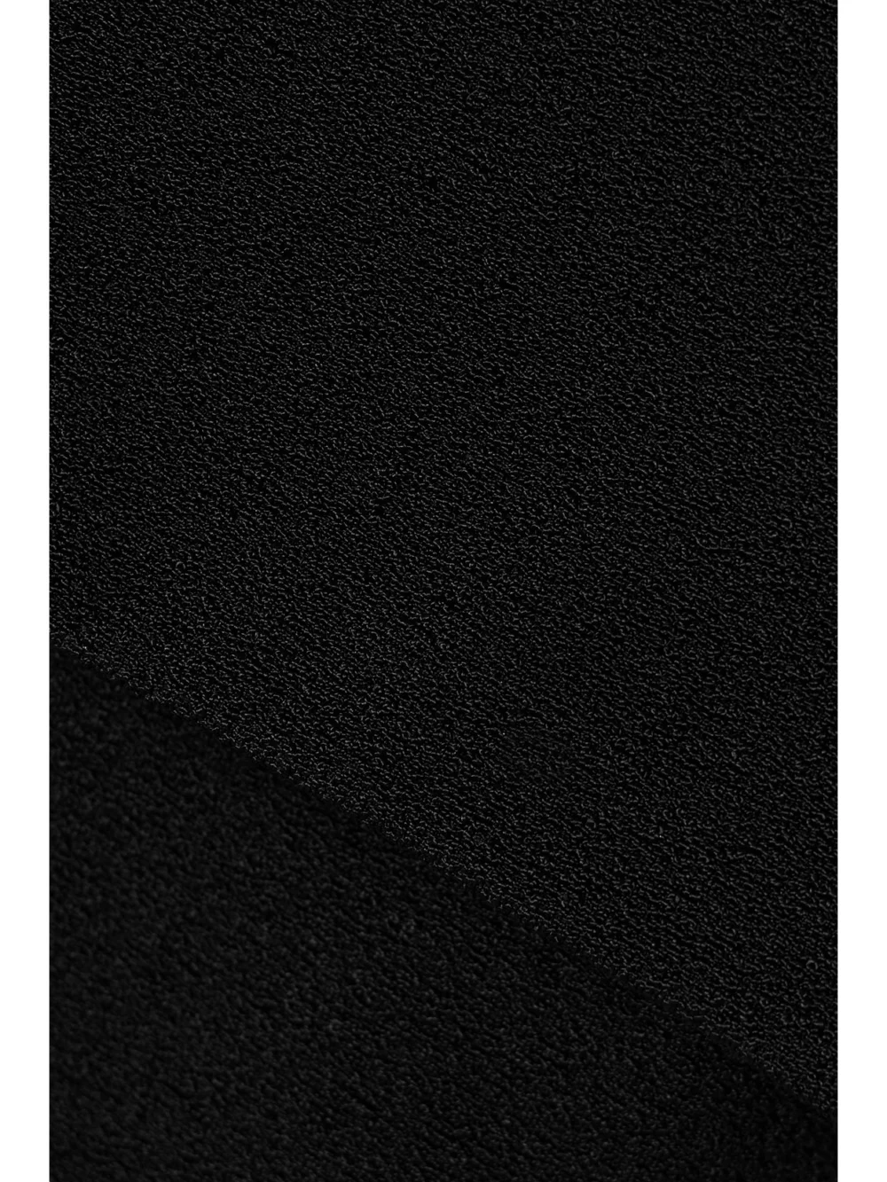 Close-up detail of the Esse Studios Omnia Off-the-shoulder Stretch-knit Mini Dress