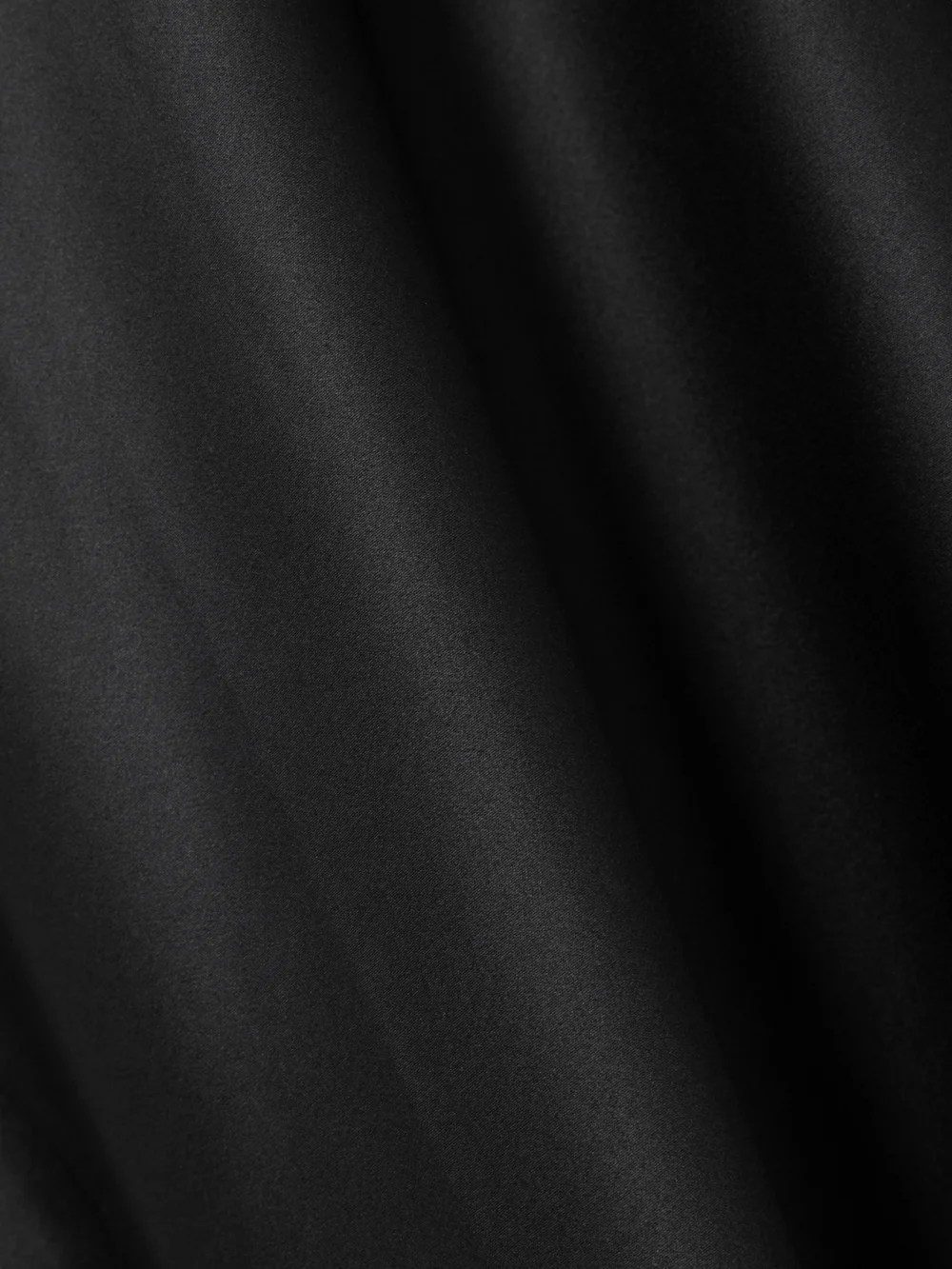 Close-up detail of the Éterne Bianca Silk-satin Maxi Skirt