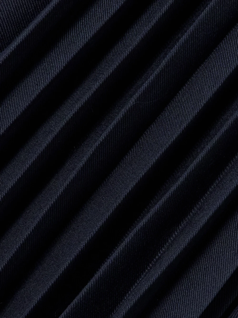 Close-up detail of the Fforme Lennox Belted Pleated Twill Trench Coat