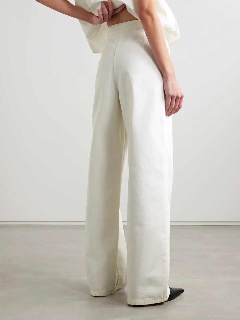 Back view of the Fforme Strider High-rise Wide-leg Jeans